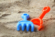 Children's beach toys on sand