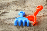 Children's beach toys on sand