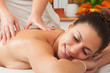 Young woman getting massage in massage salon