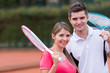 Couple playing tennis