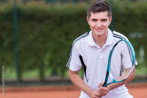 Photo: Man playing tennis Man playing tennis