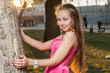 Photo: girl in backlit at sunset near tree girl in backlit at sunset near tree