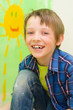 Boy draws the sun