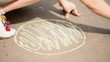 Little girl draws  sun