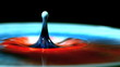 Drop splashing on multicolored paint