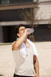 Tired athlete refreshing