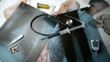 Syringe with blue liquid falling over x ray beside medical tools