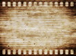 old grunge film strip with wooden background and texture