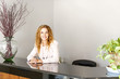 Smiling woman at office reception