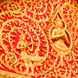 Golden budha on red background from Vientiane, Wieng Chan, Laos
