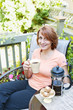 Woman relaxing in backyard