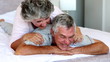 Woman giving husband shoulder rub