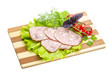 Sausages with salad and basil