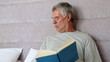 Man stops reading to take a call