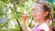 little girl with soap bubbles