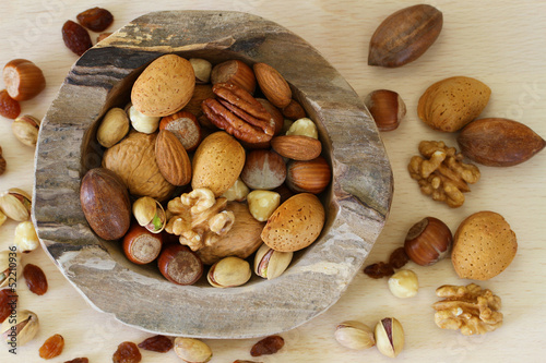 Photo: Nut variety in teak root bowl Nut variety in teak root bowl