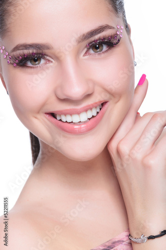 Photo: casual woman touching her face casual woman touching her face