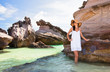 Young girl on a background of sea reefs