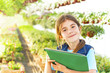 Photo: little girl in the garden flowers little girl in the garden flowers