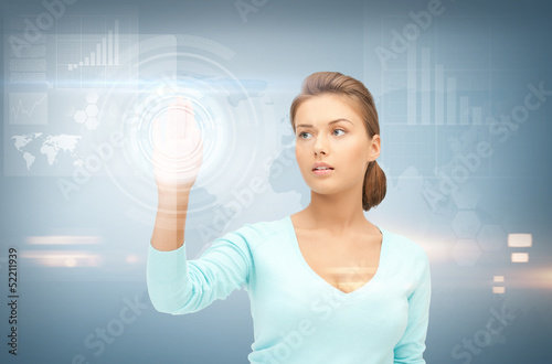 Photo: businesswoman working with something imaginary businesswoman working with something imaginary