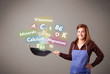 Young woman cooking vitamins and minerals
