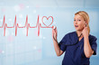 Young nurse listening to abstract pulse with red heart