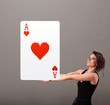 Photo: Beautifu woman holding a red heart ace Beautifu woman holding a red heart ace