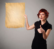Young girl presenting old paper copy space
