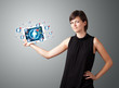 Photo: young woman holding tablet with social network icons young woman holding tablet with social network icons