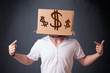 Young man gesturing with a cardboard box on his head with dollar
