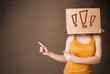 Young lady gesturing with a cardboard box on her head with excla