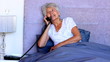 Woman in bed talking on the phone