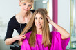 Photo: Woman at the hairdresser getting advise Woman at the hairdresser getting advise