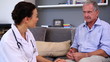 Patient talking to his doctor at home