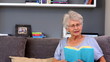 Elderly woman reading book