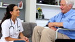 Patient in wheelchair thanking his nurse
