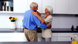 Couple dancing together in kitchen
