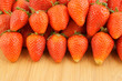 Fresh strawberries on wooden background