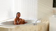 Beautiful woman getting out of bath