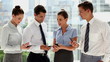 Business people comparing their smartphones