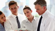 Team of business people working on tablet