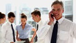 Businessman phoning in the workplace