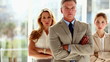 Three serious business people standing 