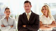 Three smiling business people standing