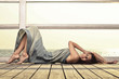 young woman is relaxing on the pier