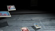 Instant photos falling on wooden boards