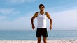 Sportsman putting hands on his waist