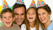 Portrait of smiling family with party hats