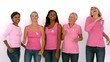 Women wearing pink ribbon against cancer dancing