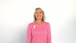 Cheerful women hiding behind another woman wearing breast cancer ribbon